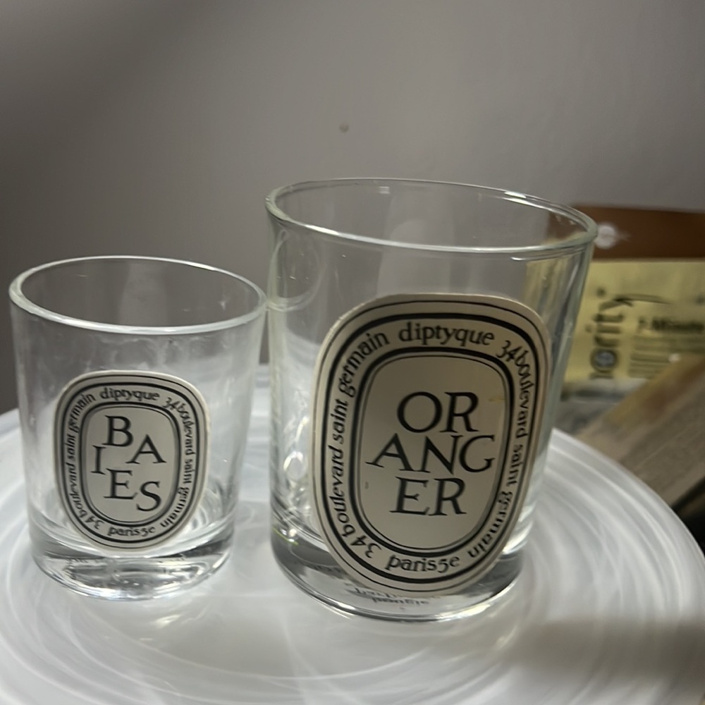 2 diptyque GLASS candle holders. $30